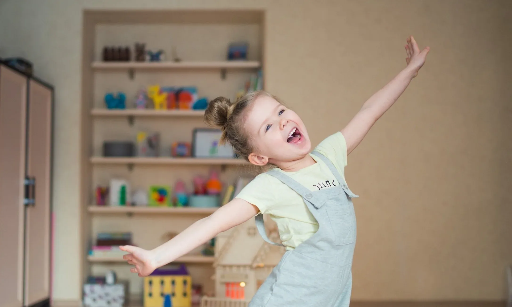 A girl dancing and singing in her room